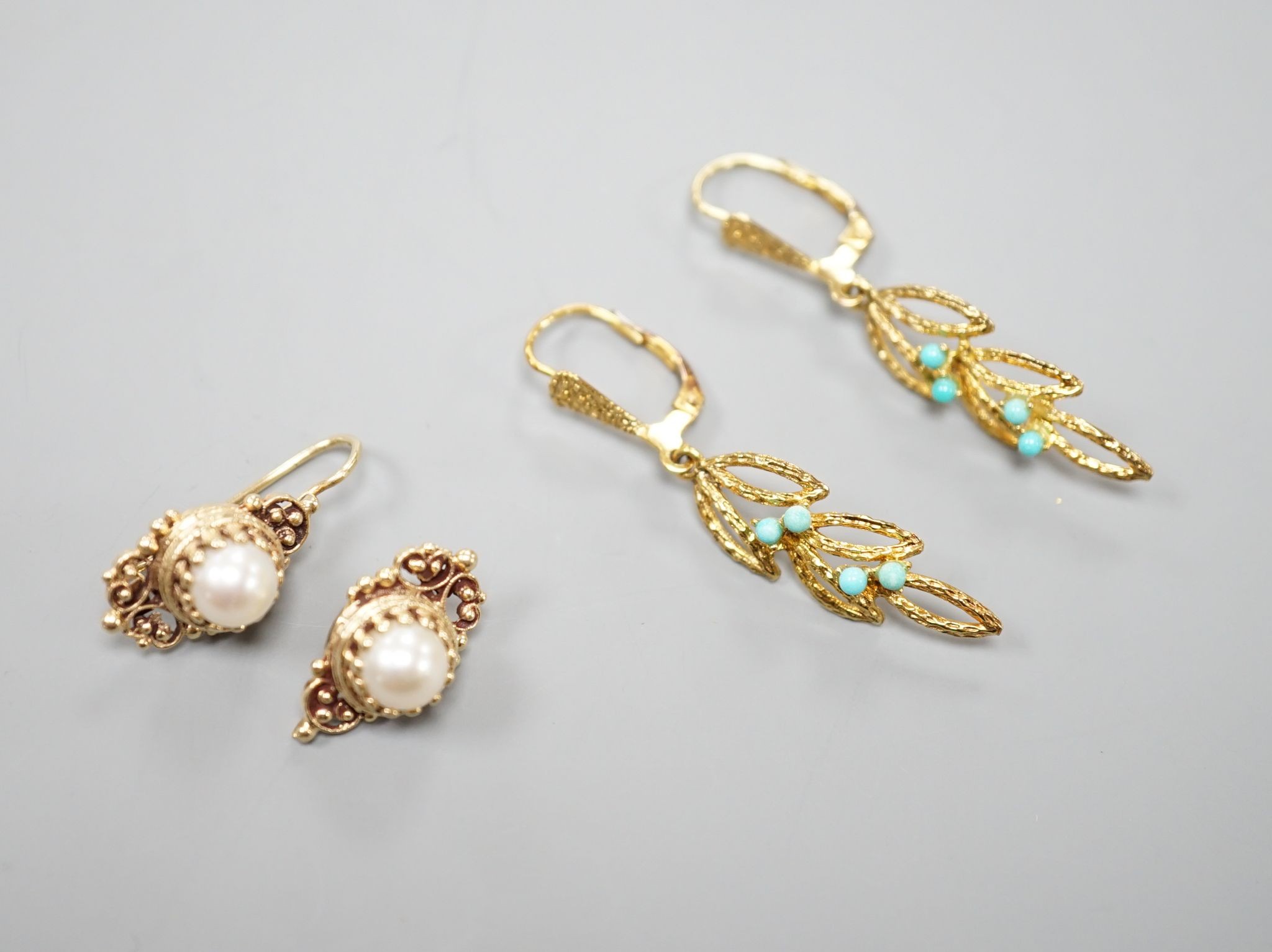 Two modern pairs of 14ct and gem set earrings, one with mabe pearl (a.f.) and one with turquoise, gross weight 7.1 grams.